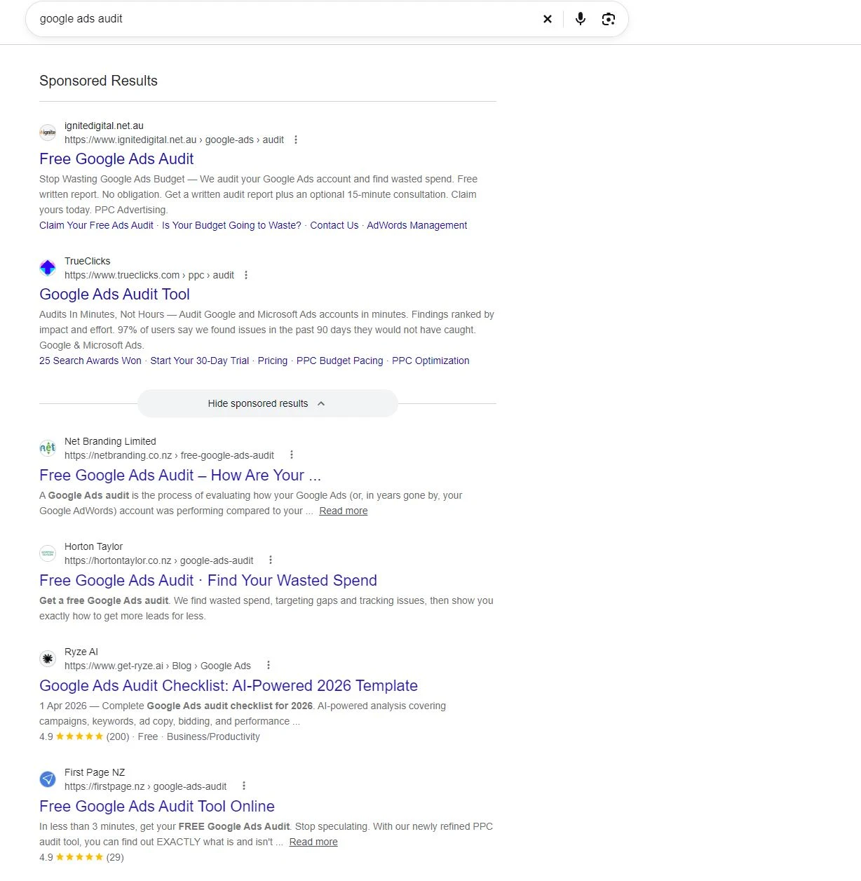 Google search results for Google Ads audits showing several providers offering free audits